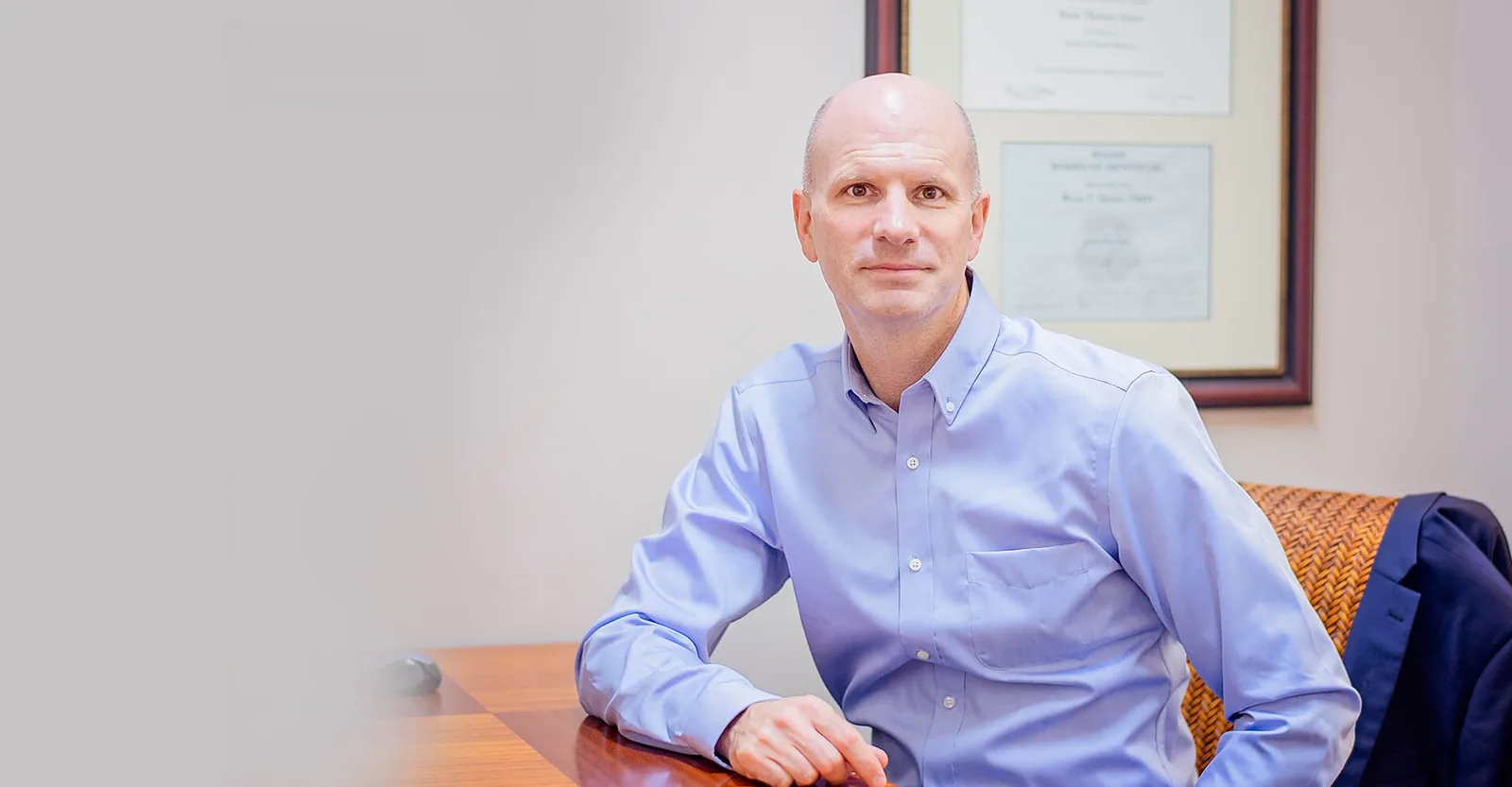 Dr. Ryan Speirs seated at a desk in his office