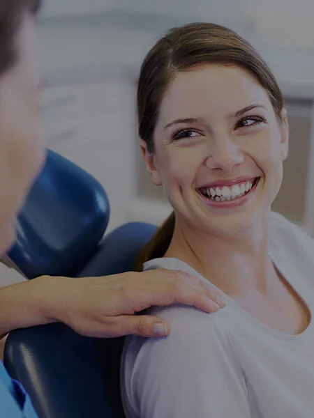 A smiling woman in the dentist's chair